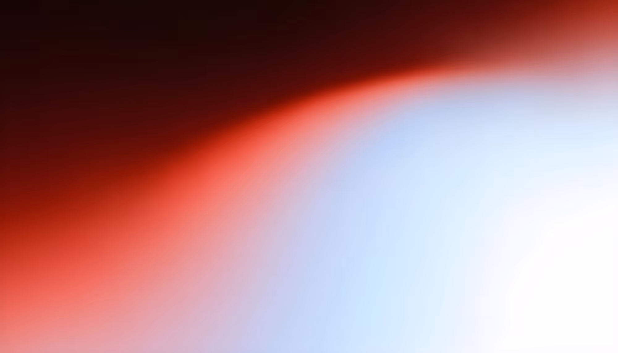 Abstract image with a gradient blend of deep red in the top left transitioning to soft blue and white in the bottom right, creating a serene, atmospheric feel.
