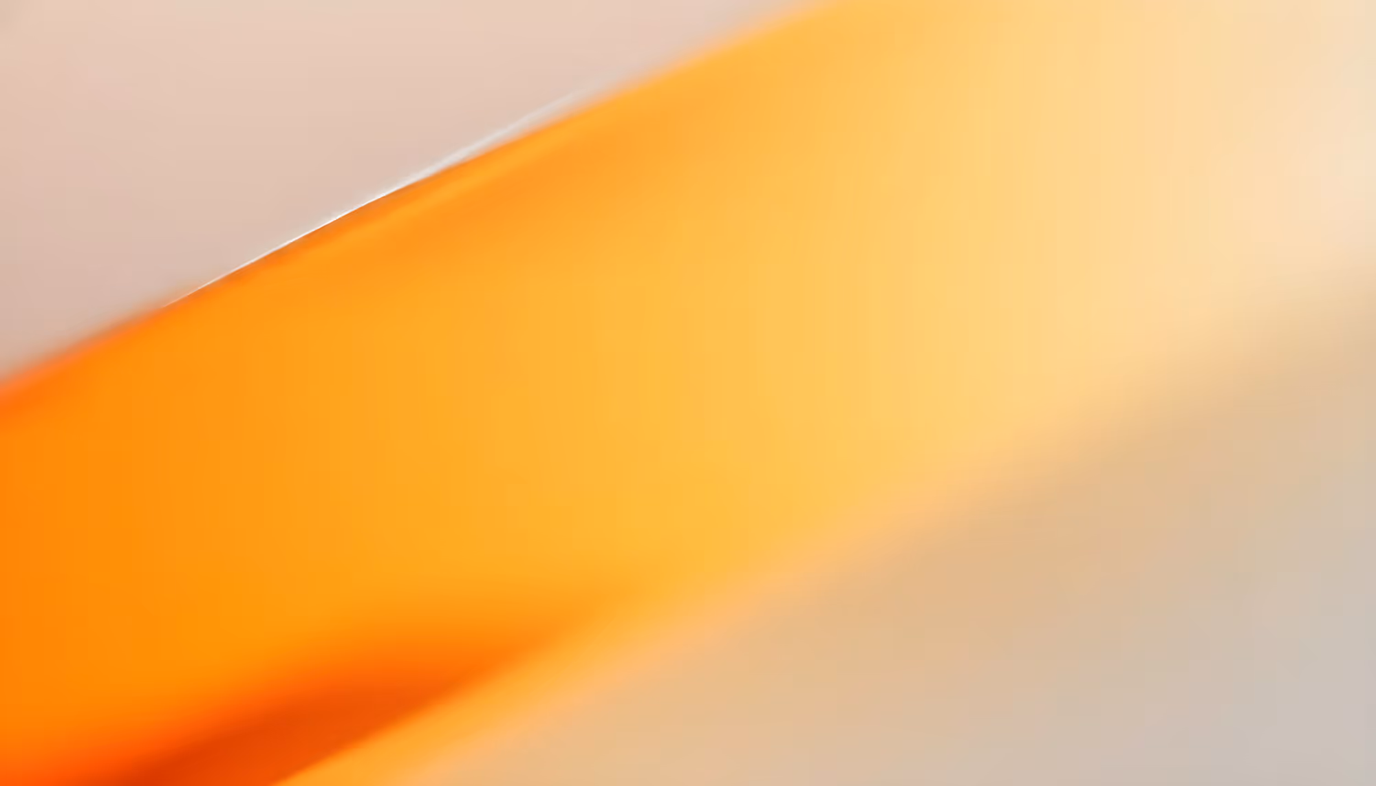 Abstract image with a gradient of warm tones, featuring a dominant orange band blending into soft beige. The composition is smooth and evokes a calm mood.