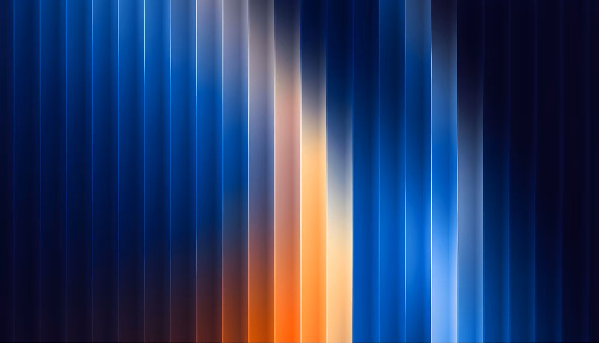 Abstract image featuring vertical stripes in varying hues of blue, orange, and yellow. The smooth gradient creates a dynamic, modern, and vibrant feel.