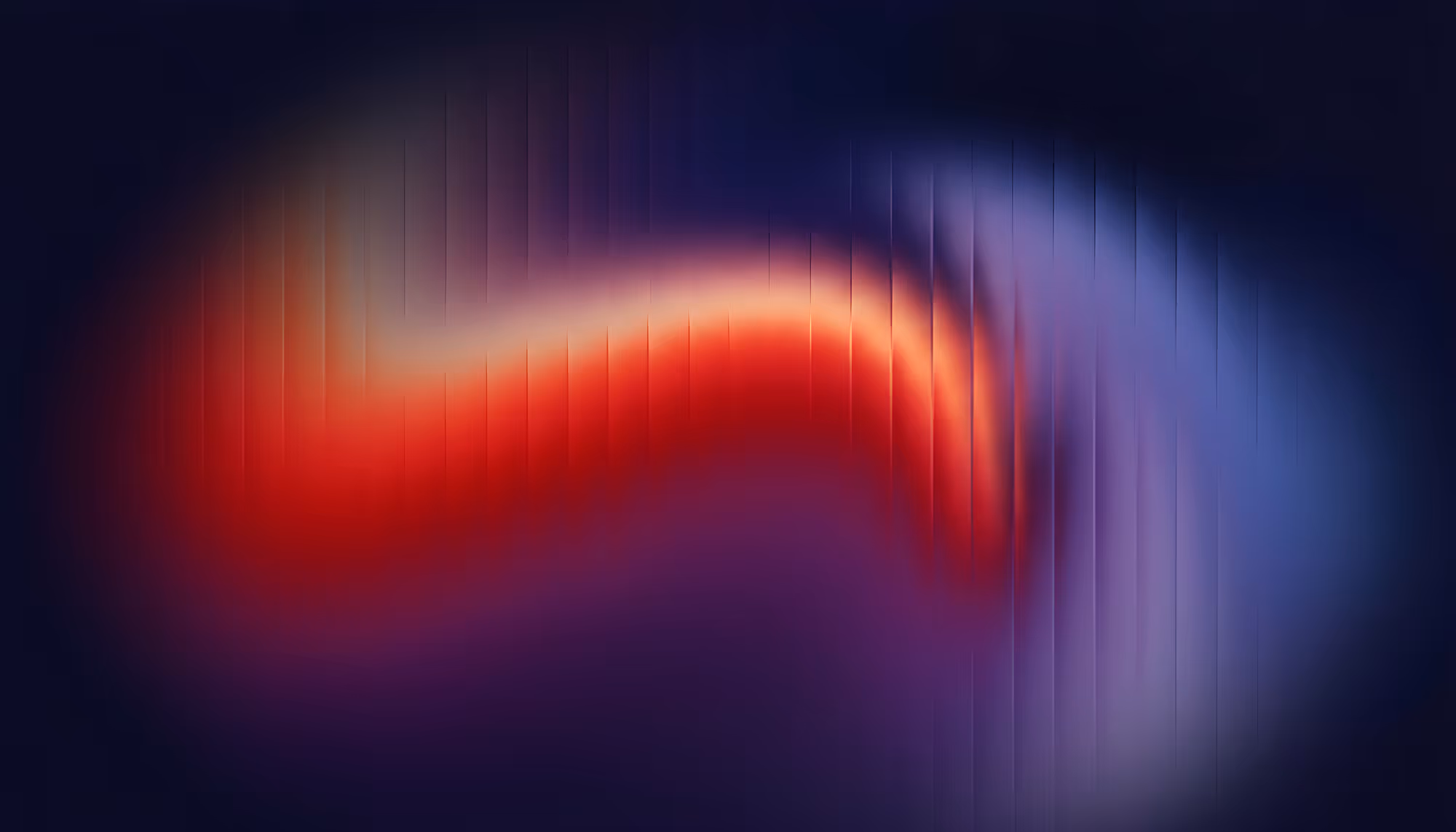 Abstract image of a wavy blend of vivid red and blue colors with a blurred, vertical line texture on a dark background, creating a dynamic, energetic feel.