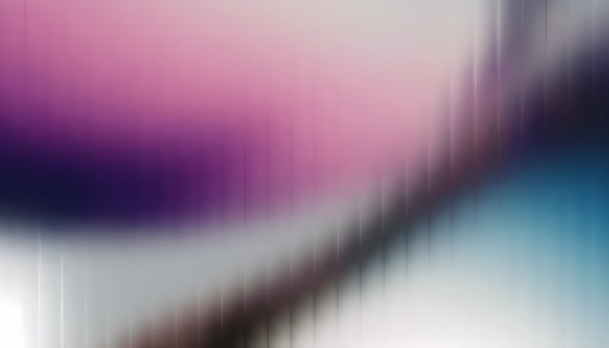 Abstract image with a gradient of blurred pink, purple, and blue hues blending diagonally. Vertical lines create a dynamic, ethereal feel.