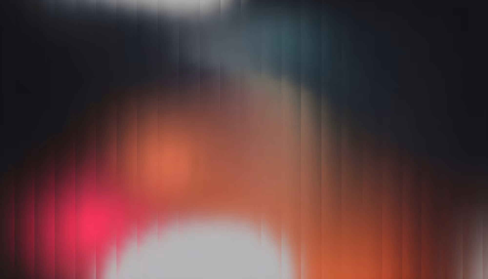 Abstract image with blurred gradients of red, orange, and blue, forming a soothing and mysterious wave pattern. Vertical lines add texture and depth.