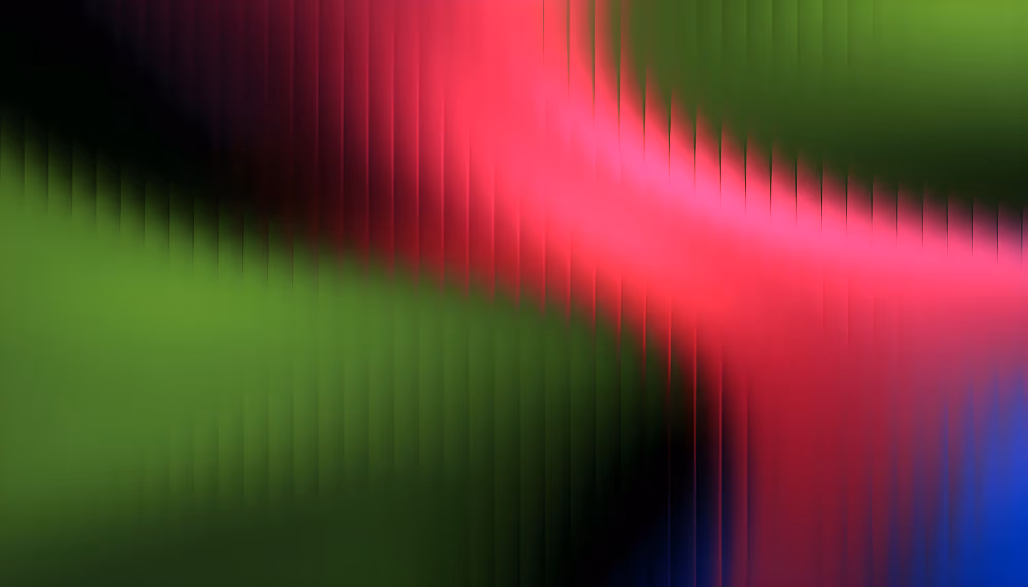 A vibrant abstract image with smooth gradients blending green, red, and blue colors. The wavy texture and vivid hues create a dynamic and energetic feel.