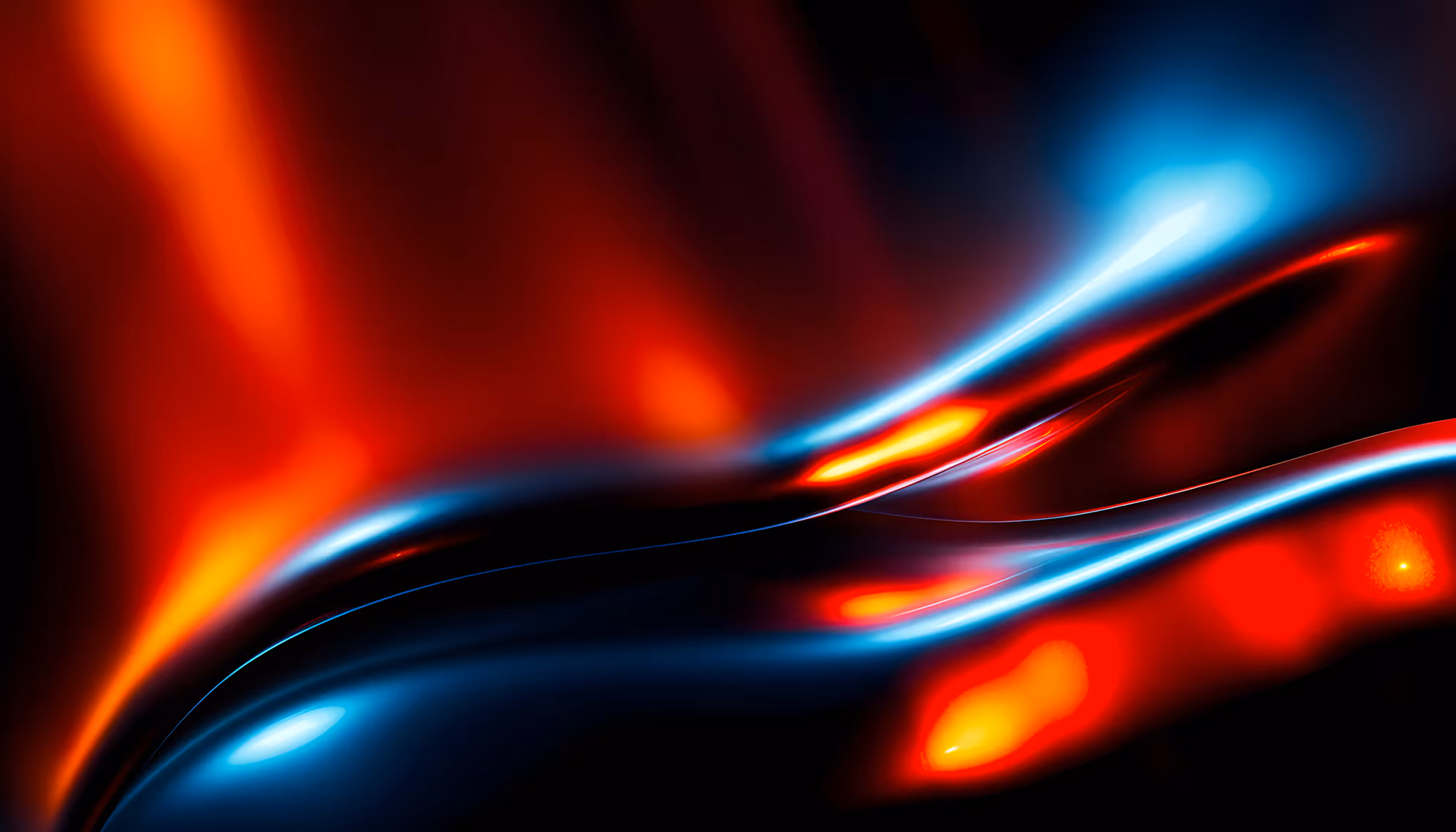 Abstract image with flowing waves of red and blue light on a dark background. The smooth curves create a dynamic, ethereal feeling.