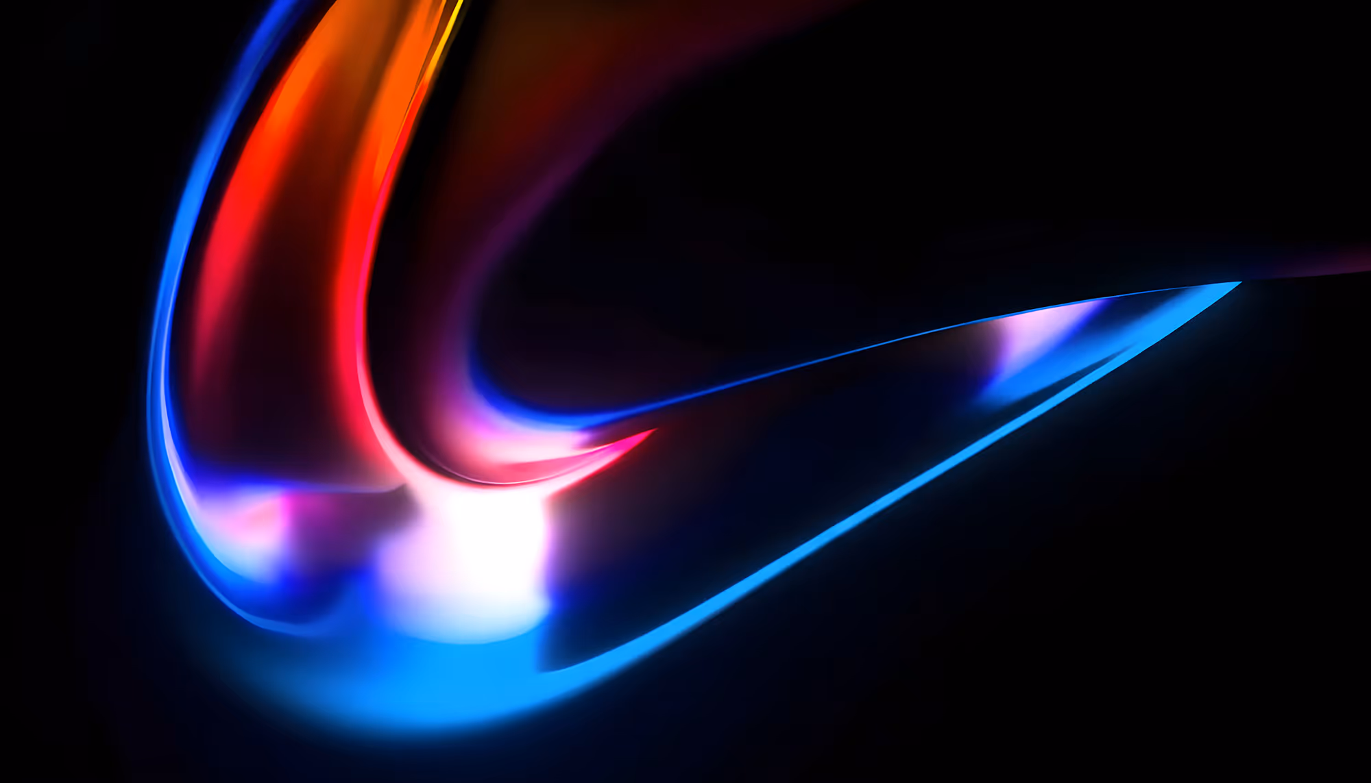 Abstract image with vibrant swirling lights in red, blue, and purple on a black background, creating a dynamic and energetic atmosphere.