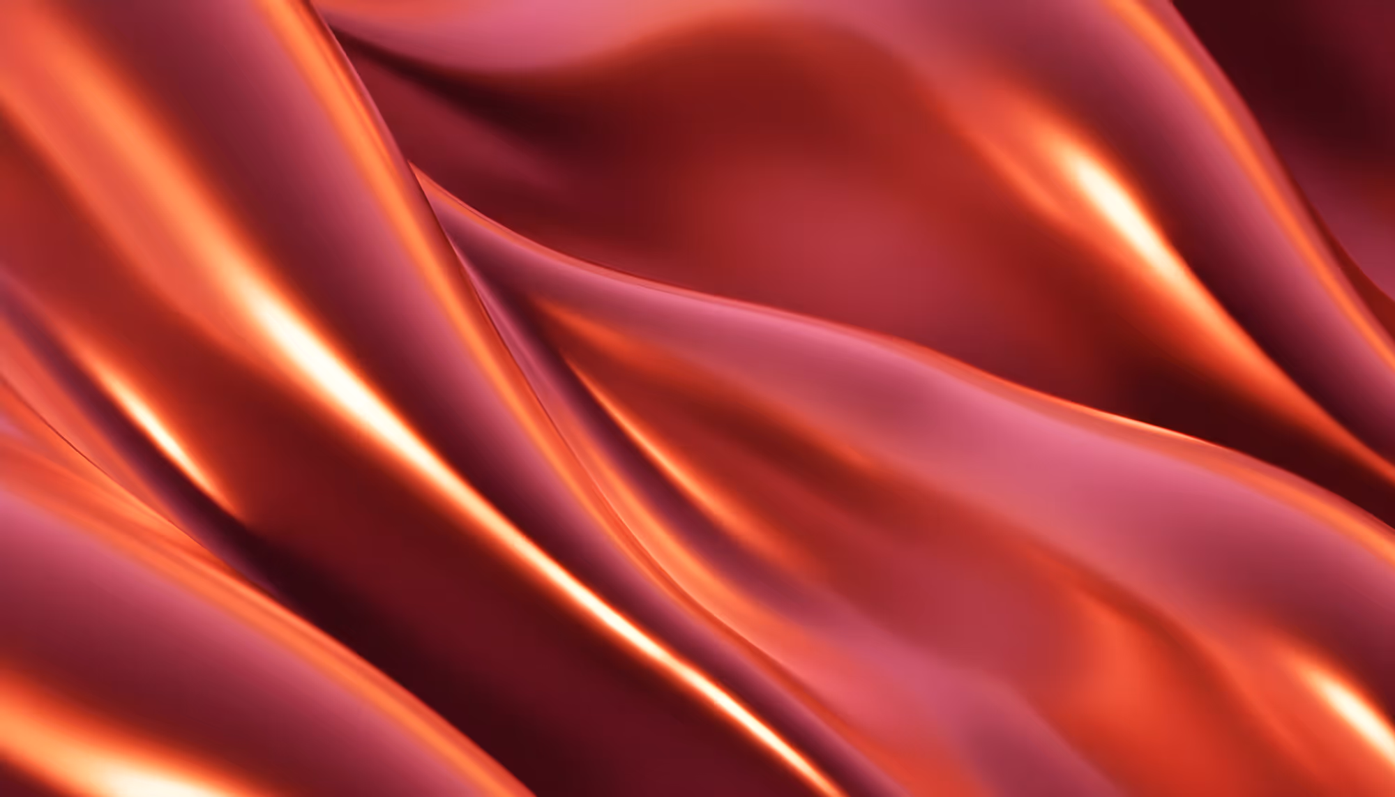 A smooth, flowing fabric in rich shades of red and orange with a glossy finish. The folds create a sense of luxury and fluidity, with warm highlights.