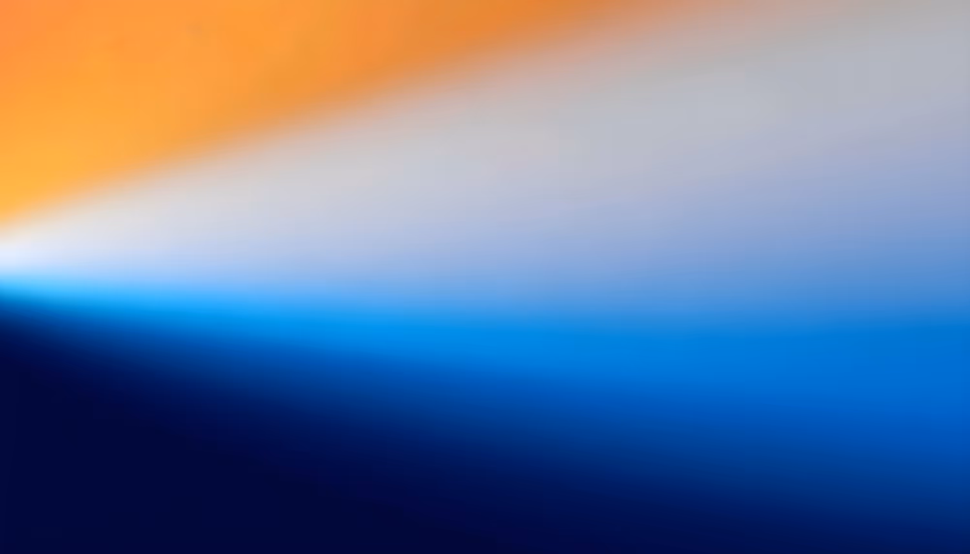 A gradient of colors transitioning from warm orange to cool blue, forming a smooth abstract spectrum. The blend creates a serene, calming effect.