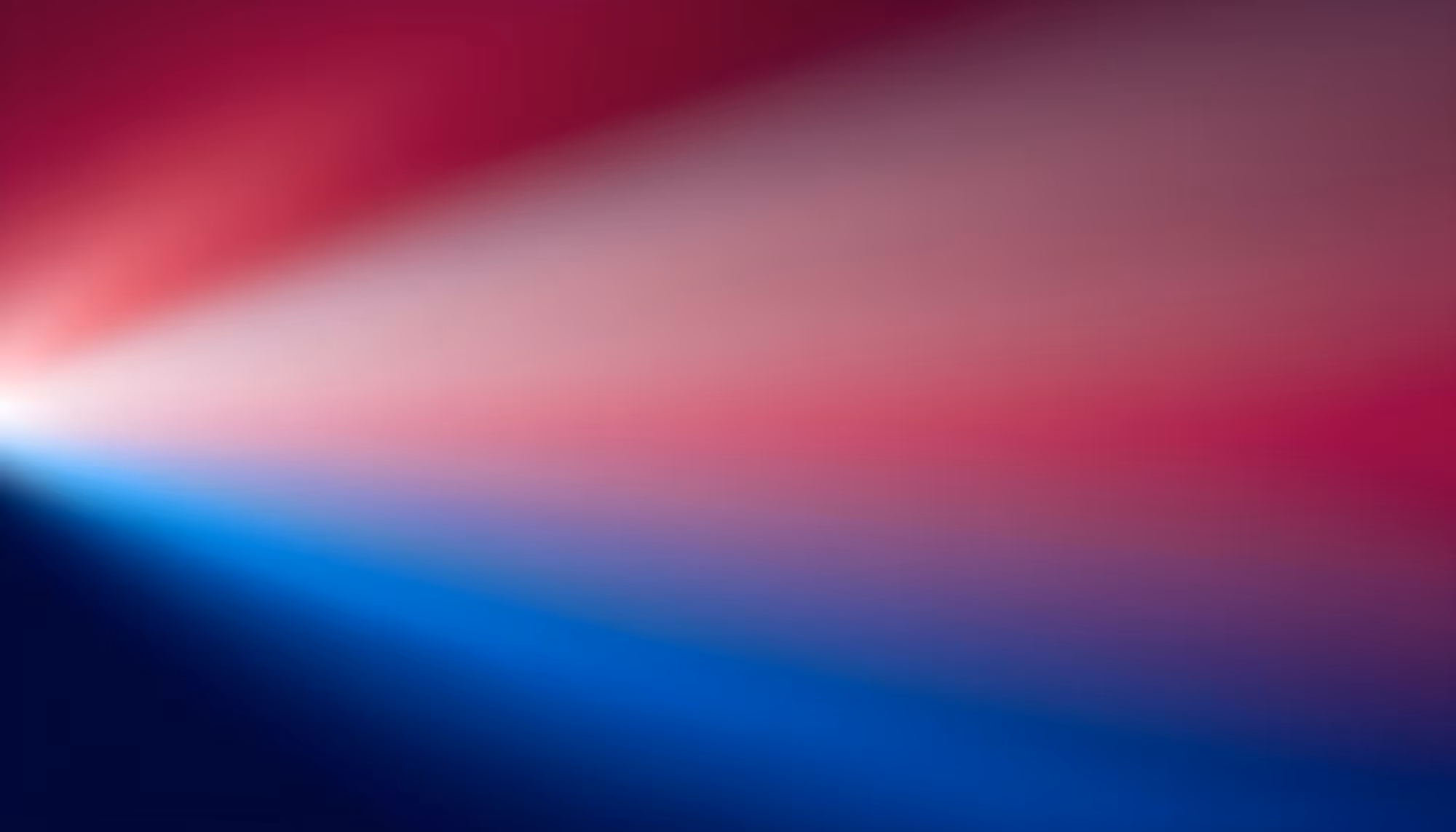 A dynamic gradient of blurred red at the top and deep blue at the bottom converges into white light on the left, creating a dramatic and vibrant effect.