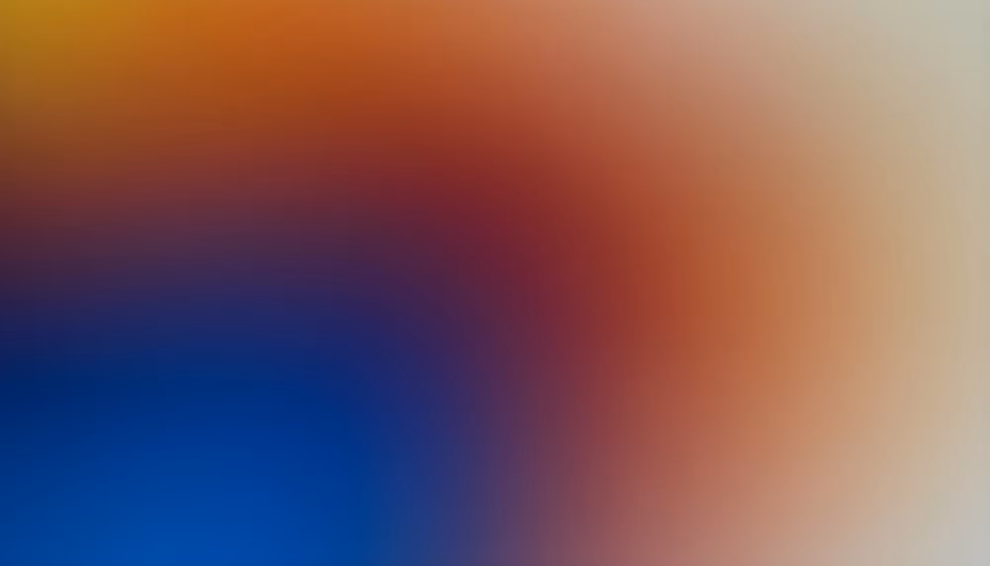 A vibrant gradient image blending bright blue, red, and orange hues smoothly from bottom left to top right, evoking an energetic and dynamic mood.
