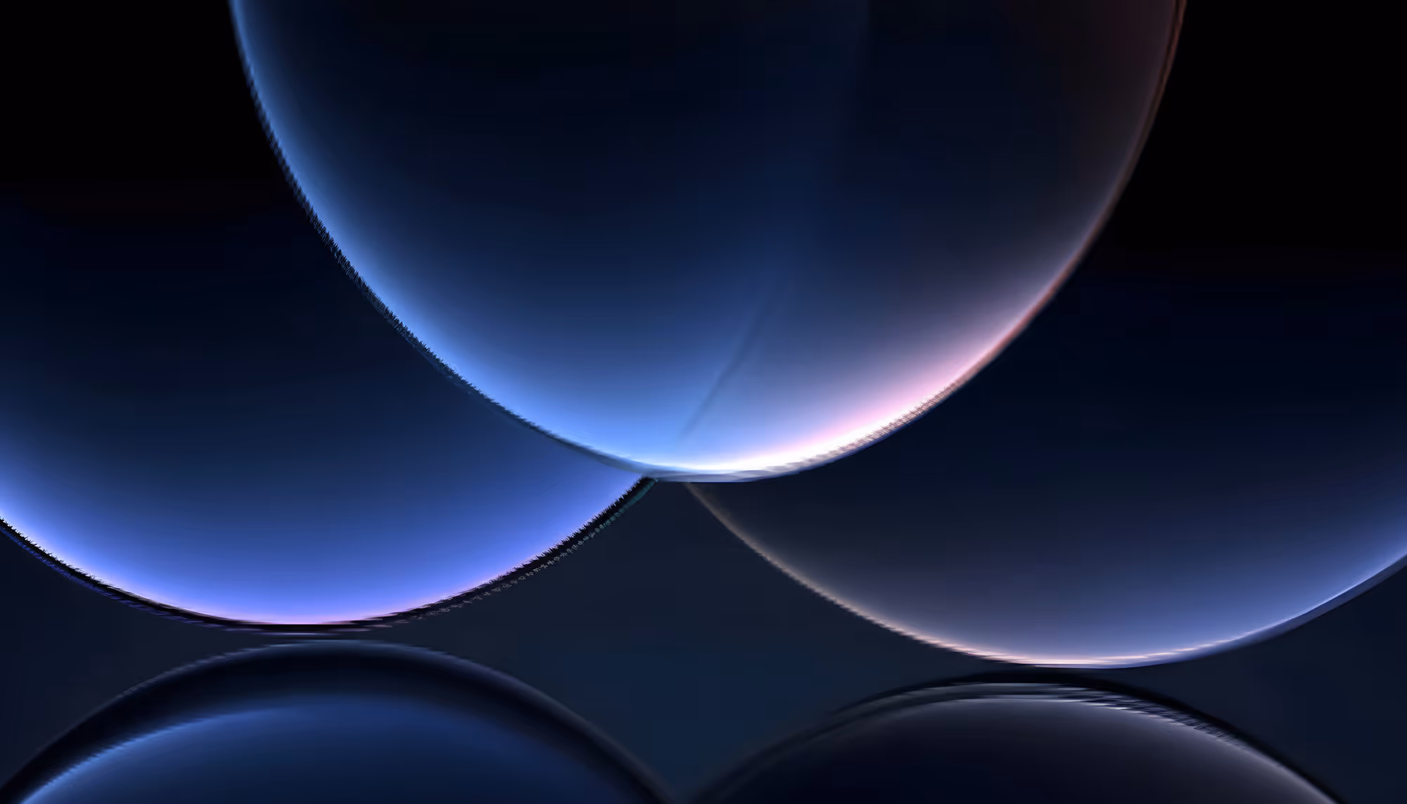 Abstract image featuring overlapping translucent spheres with a gradient of blues, purples, and blacks against a dark background, creating a serene, cosmic feel.