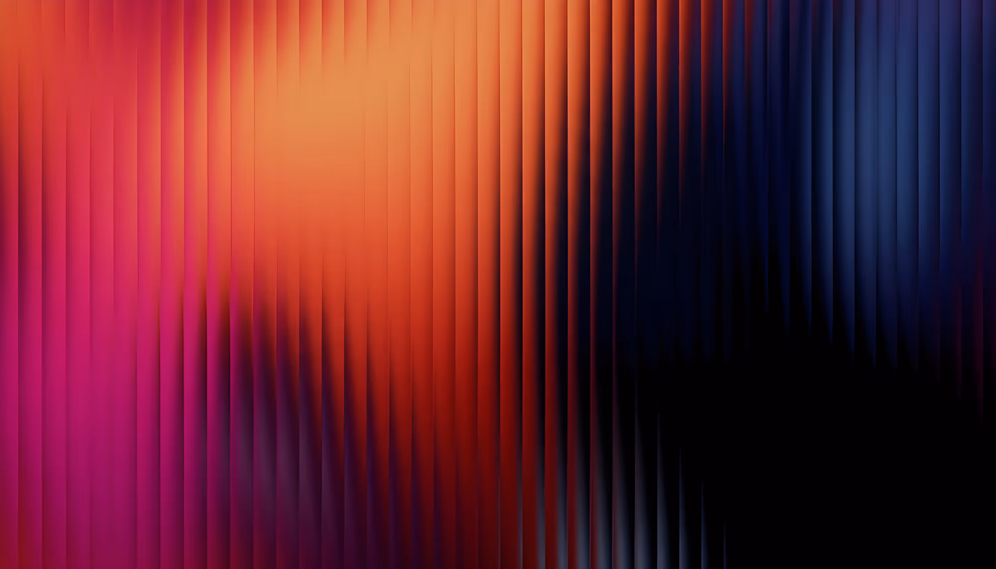 Abstract image with vertical lines in warm pink, orange, and cool blue tones blending together, creating a wavy, energetic, and vibrant effect.
