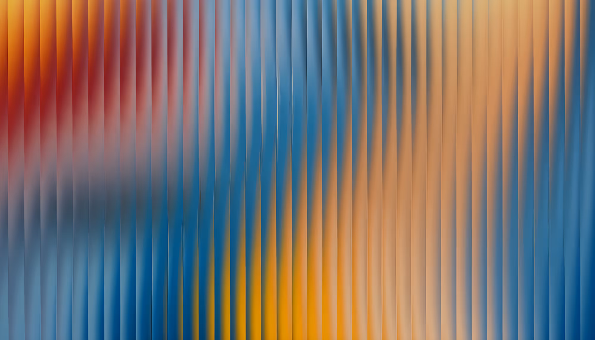 Abstract image with vertical, wavy lines blending red, blue, and orange hues. The pattern creates a dynamic, flowing movement, adding a vibrant energy.