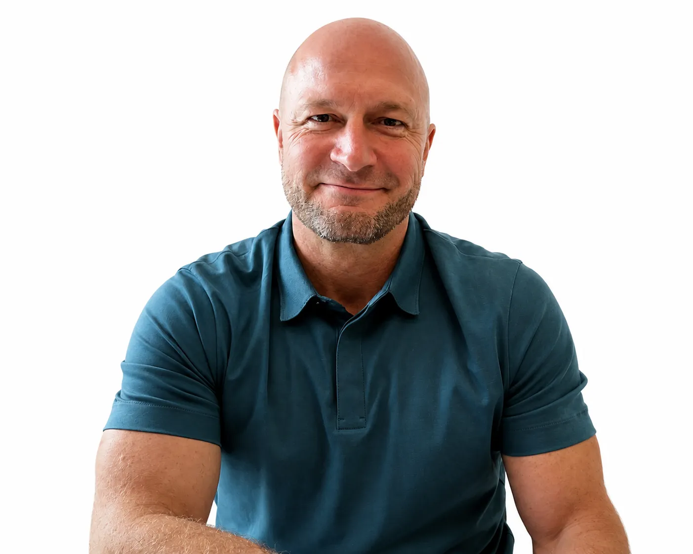 Smiling bald man with short beard wearing a teal polo shirt against a white background.