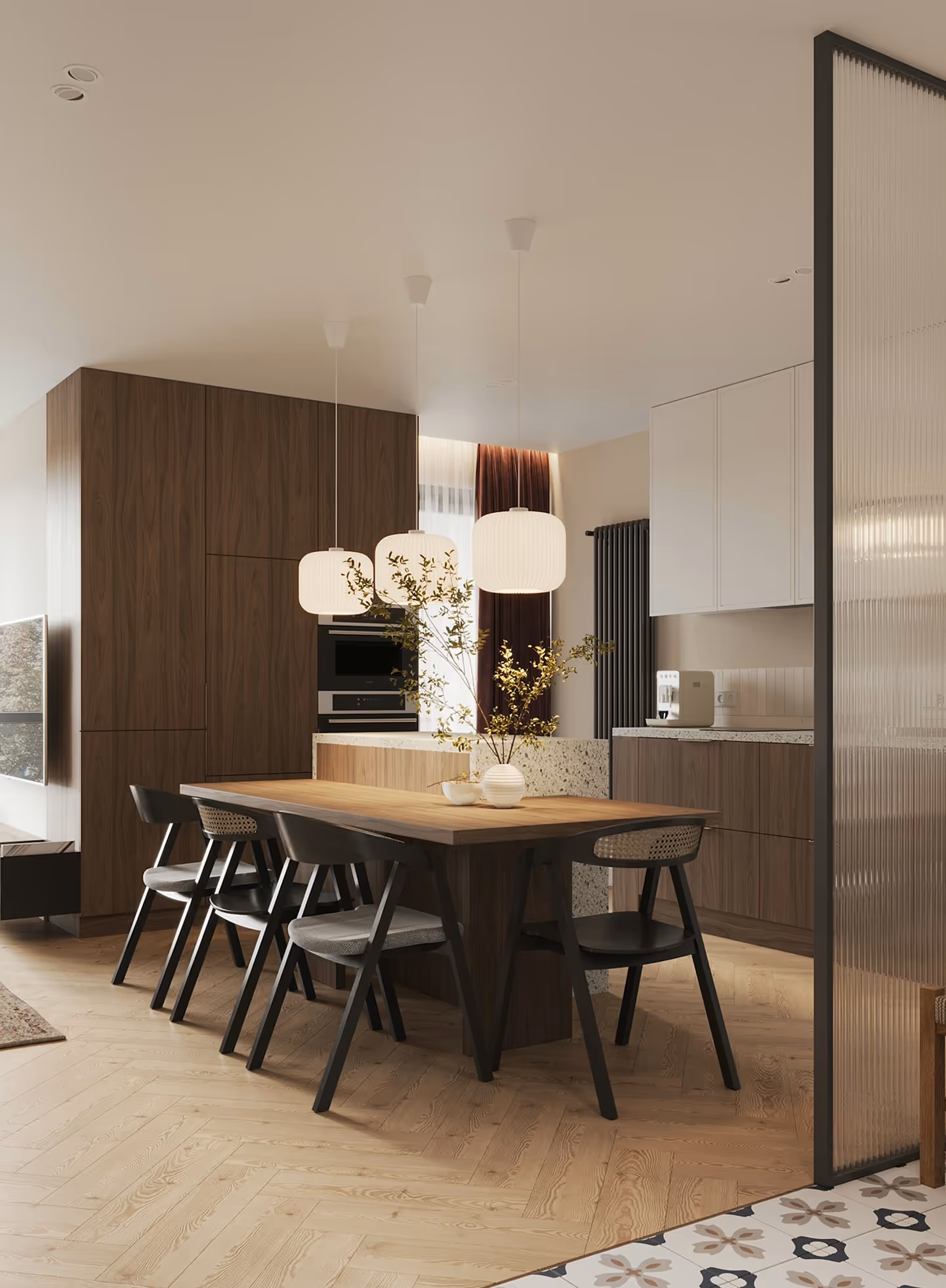 Modern kitchen and dining area with wooden table, four black chairs, pendant lights, and wood cabinetry.