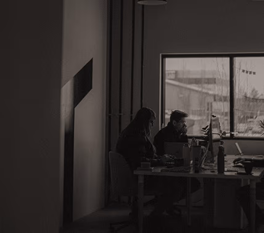 The Greaterthan Studio founders reviewing a project together at a desk