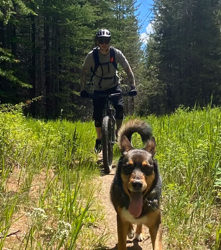 Matt mountain biking with a dog