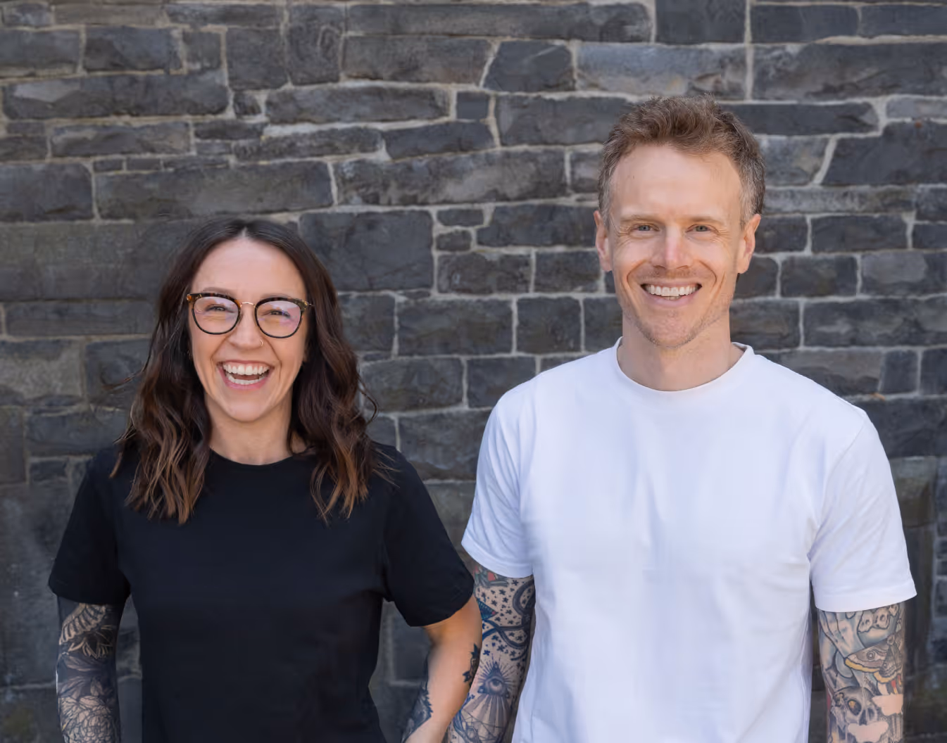 Matt and Missy, co-founders of Greaterthan Studio, in a bright modern office