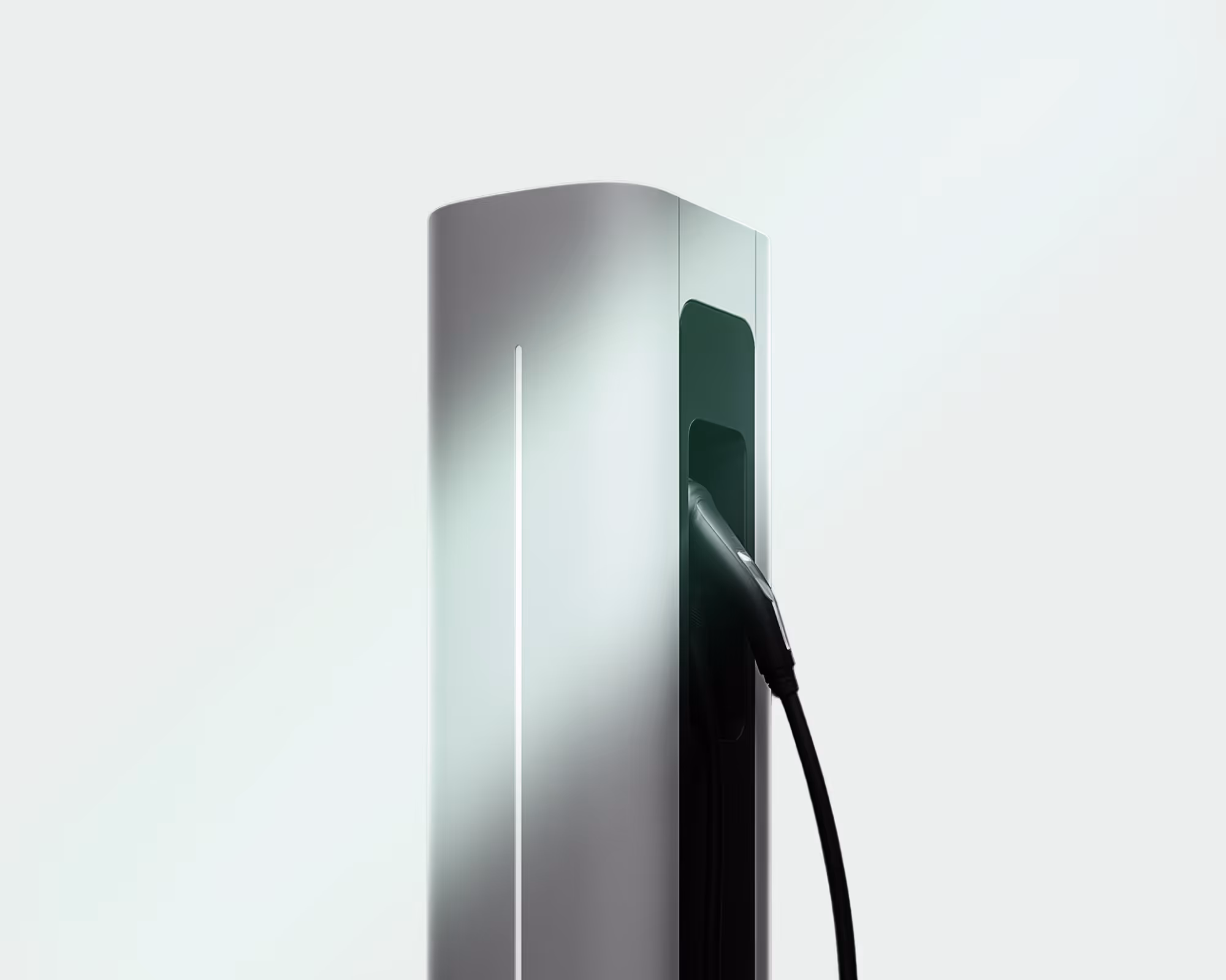 Modern silver electric vehicle charging station with a plugged-in black charging connector.