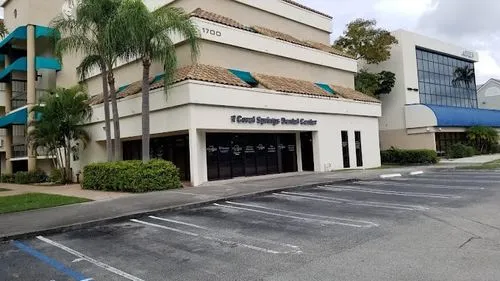An empty parking lot in front of a building.