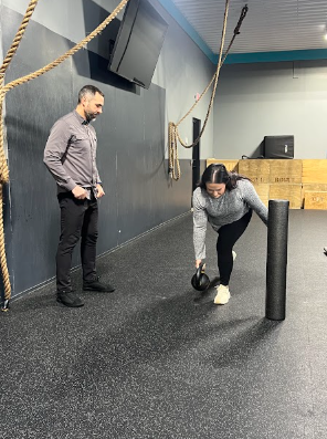 Patient working with a provider at a sports chiropractic and strength conditioning clinic in Hillsdale, MI
