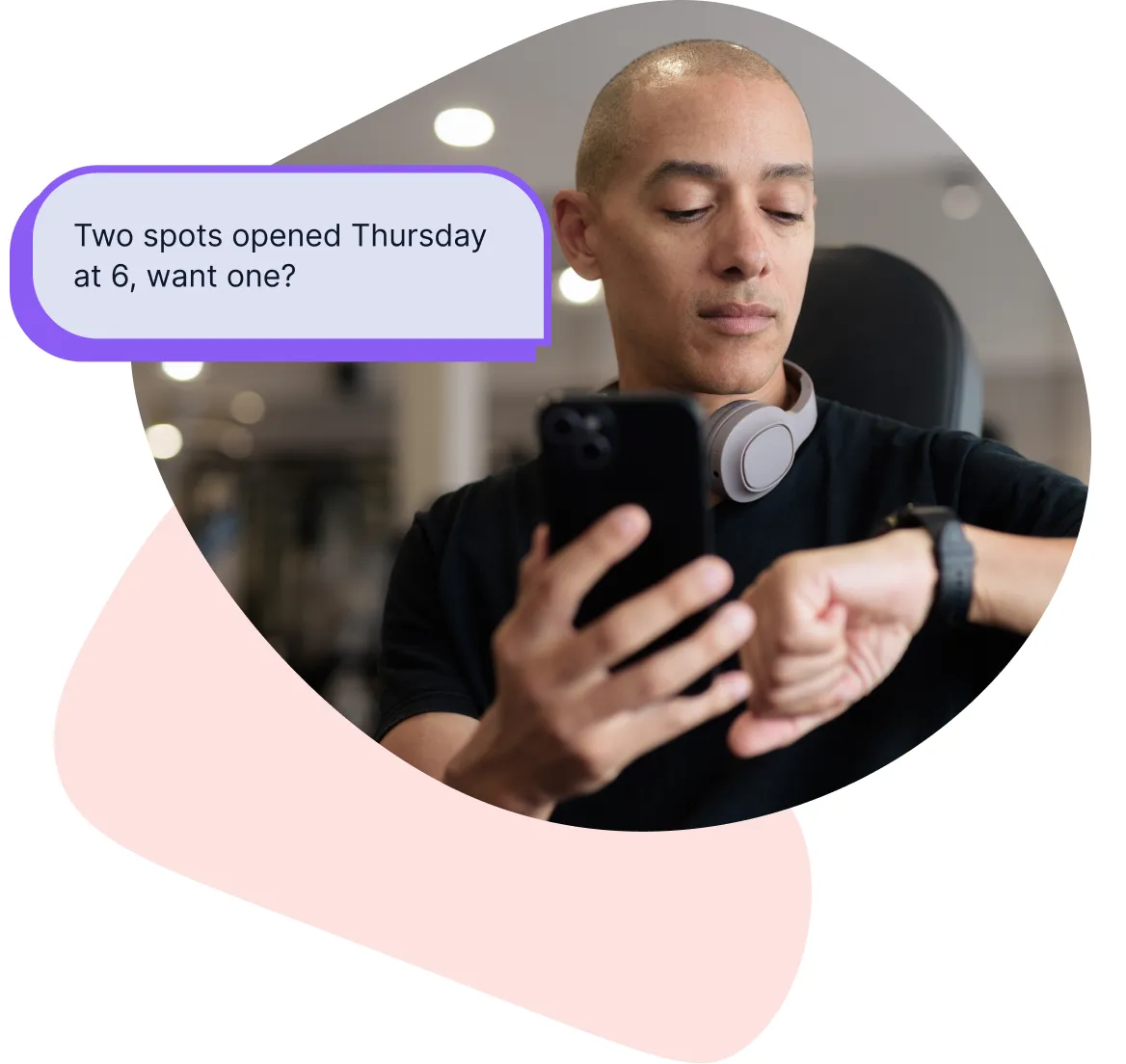 A gym client reading a text message on their phone