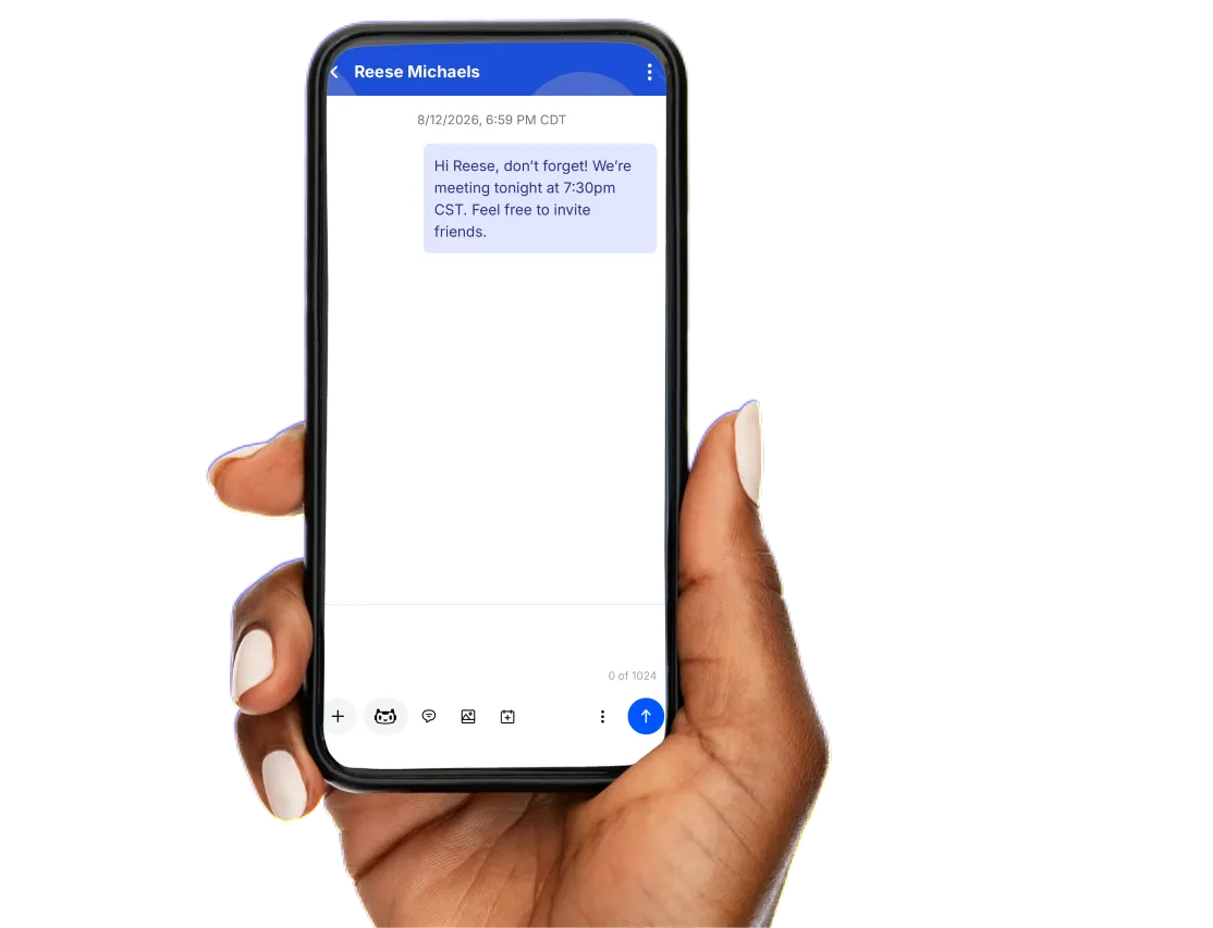 A hand holding a phone showing a text conversation