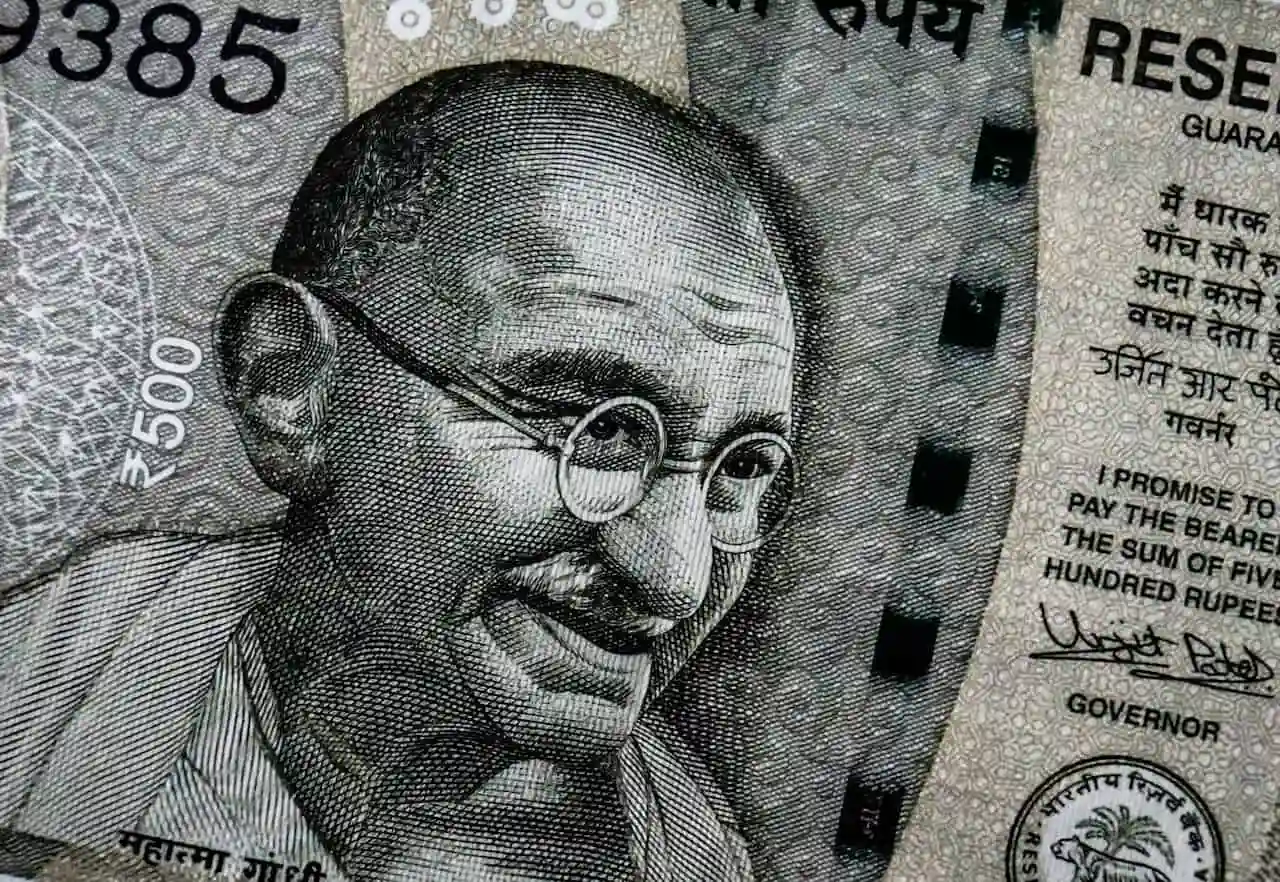 Close-up of an Indian ₹500 banknote featuring a detailed portrait of Mahatma Gandhi, with security features and text in Hindi and English.