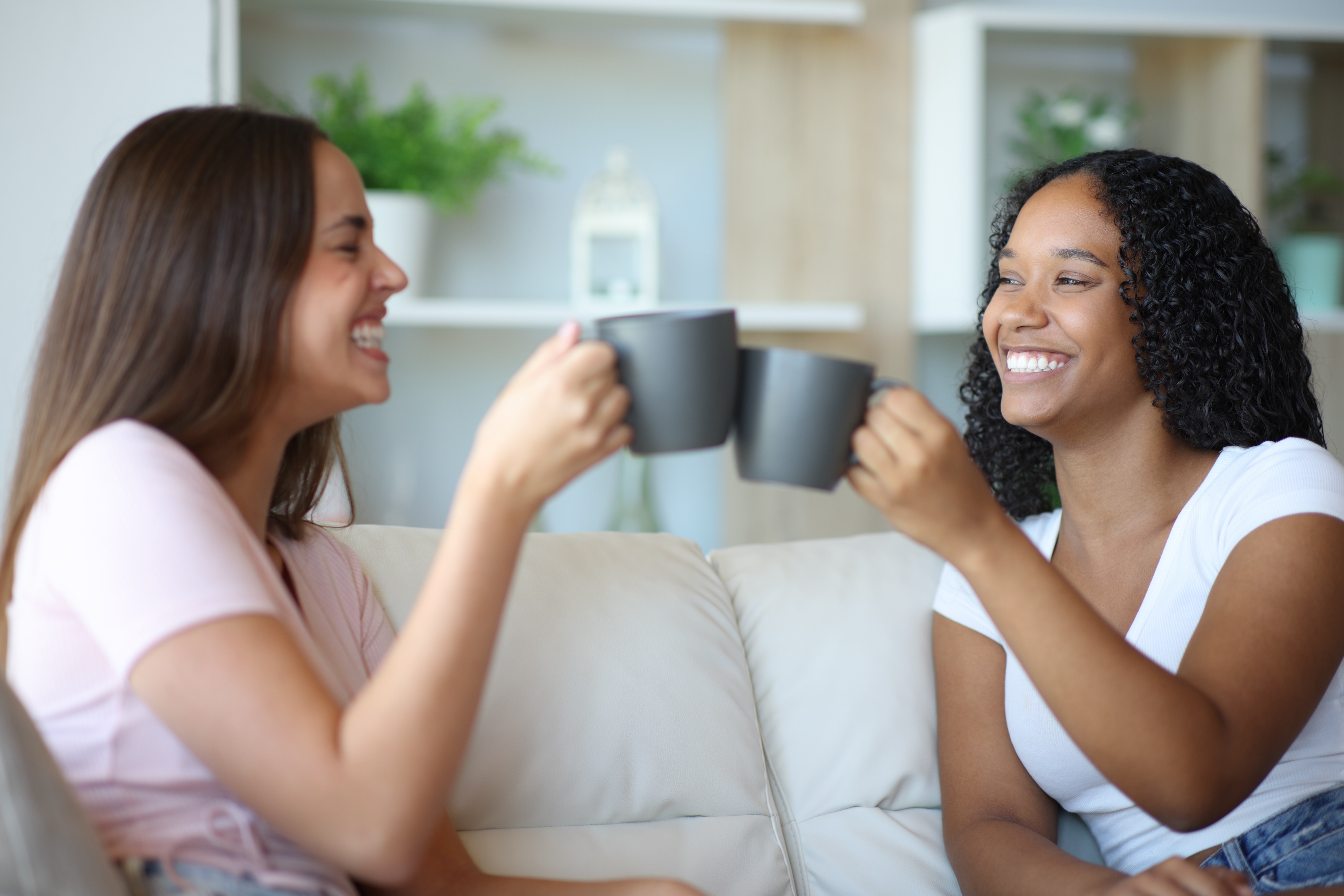 Roommates smiling in apartment in houston