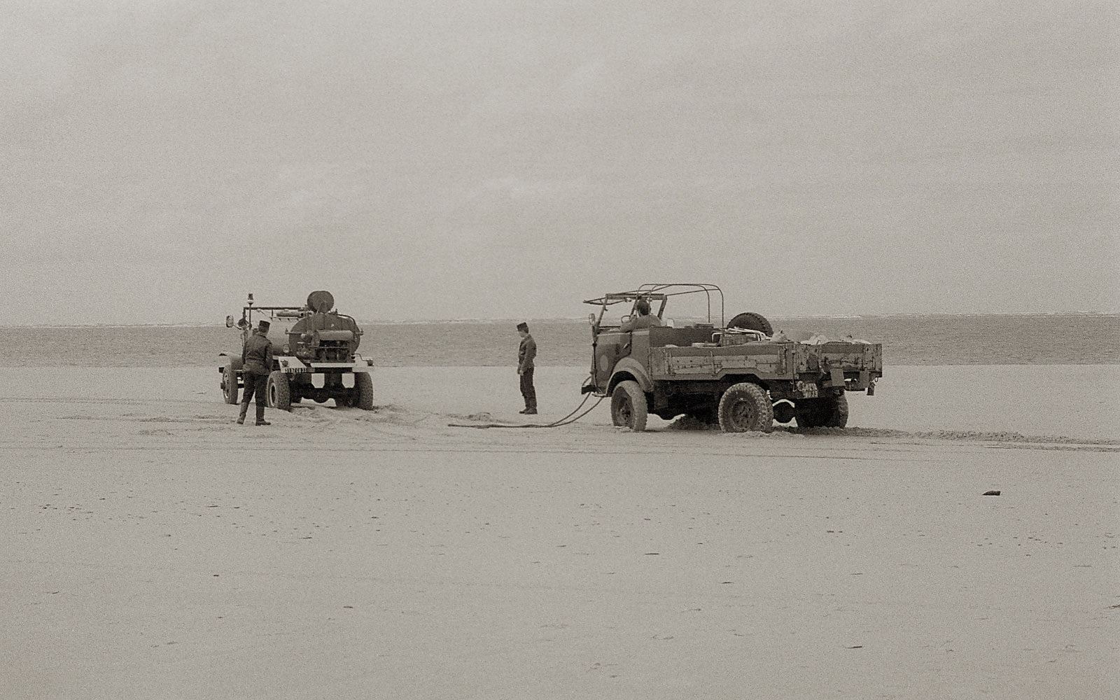 Police and tractor on a beach, France