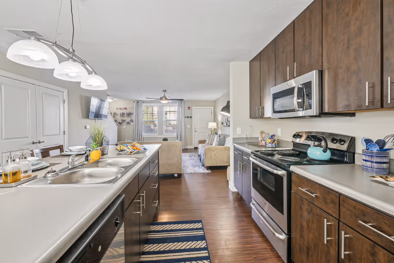 Kitchen with brown cabinets and stainless steel appliances