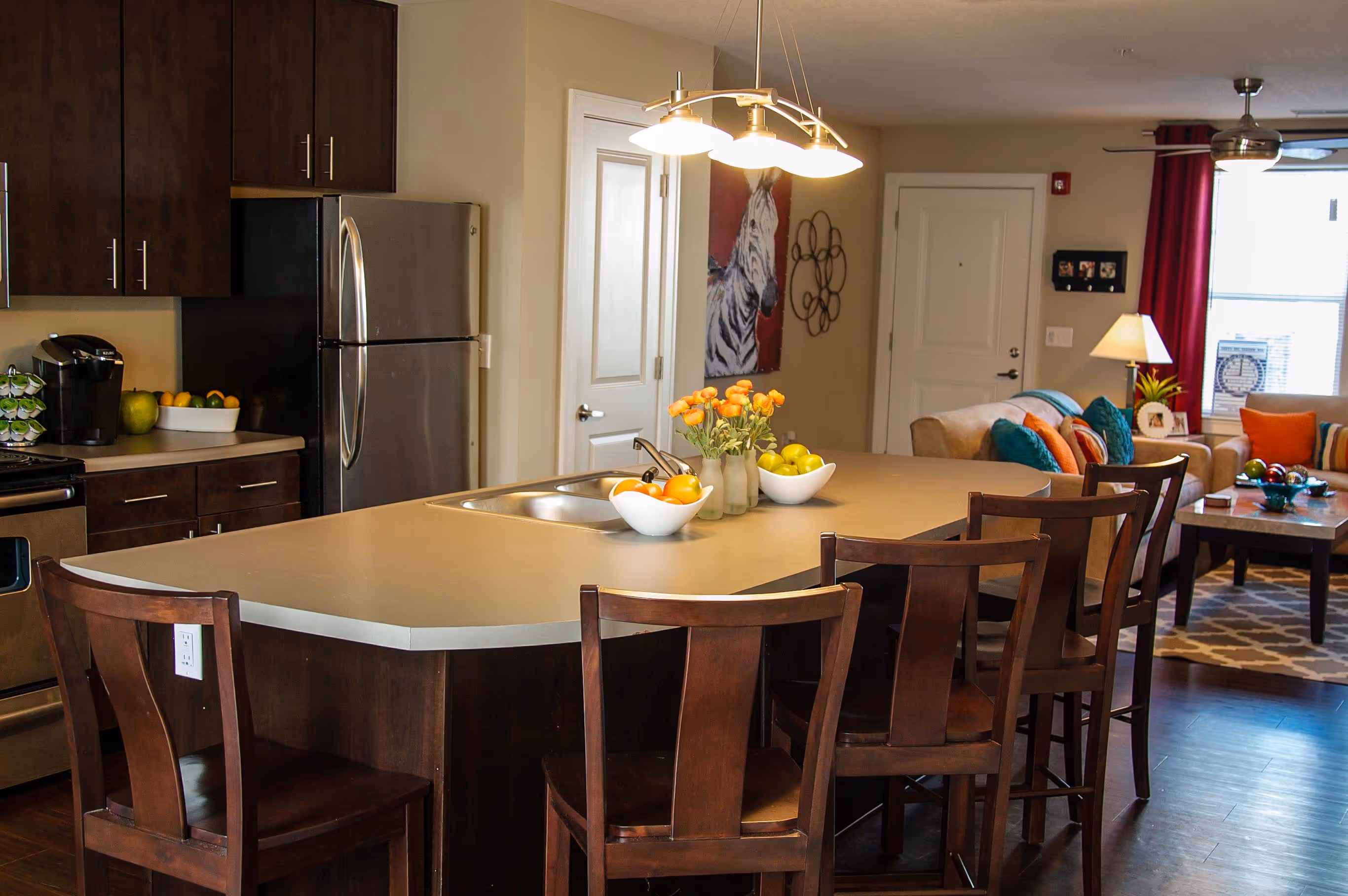 Kitchen island with brown chairs