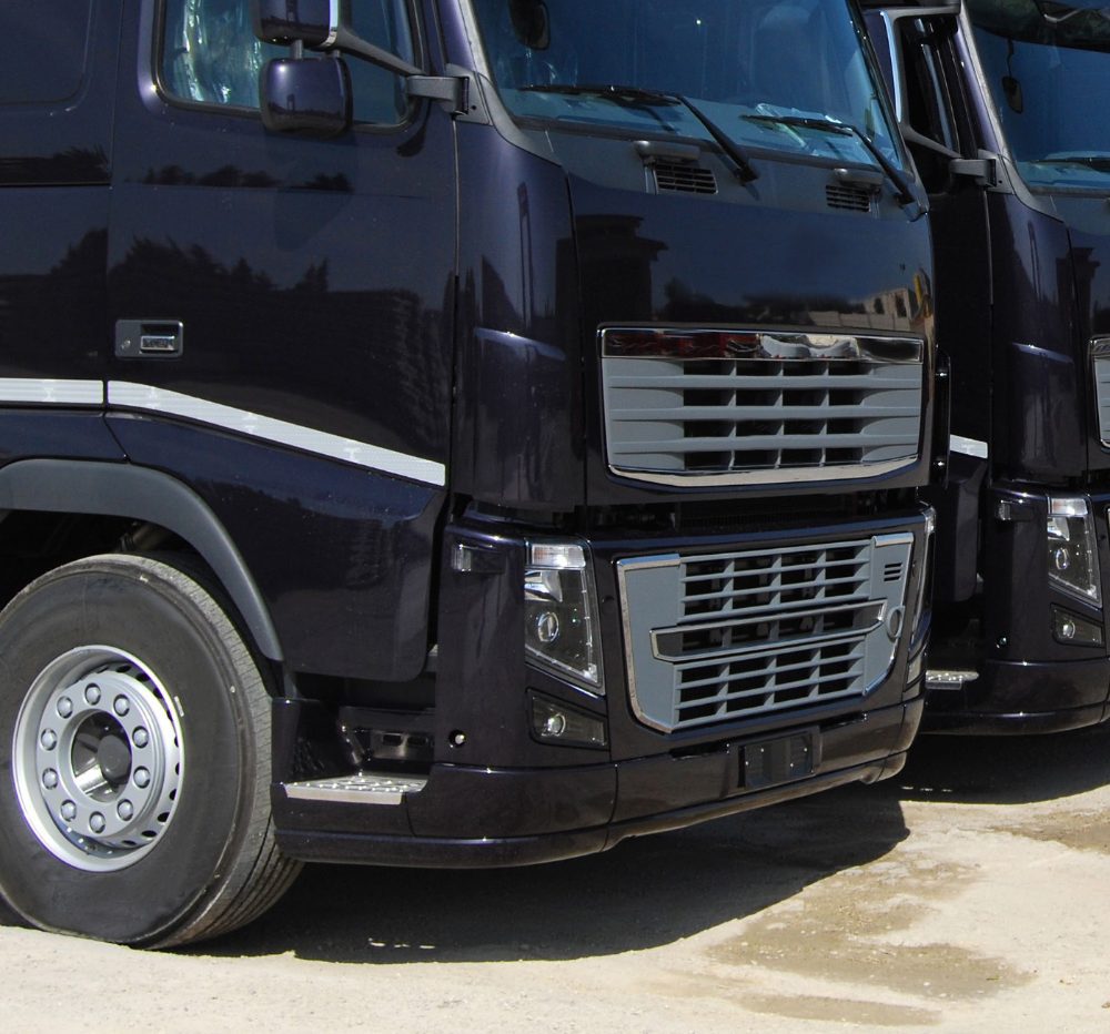 Close-up of parked HGV cabs in a fleet yard