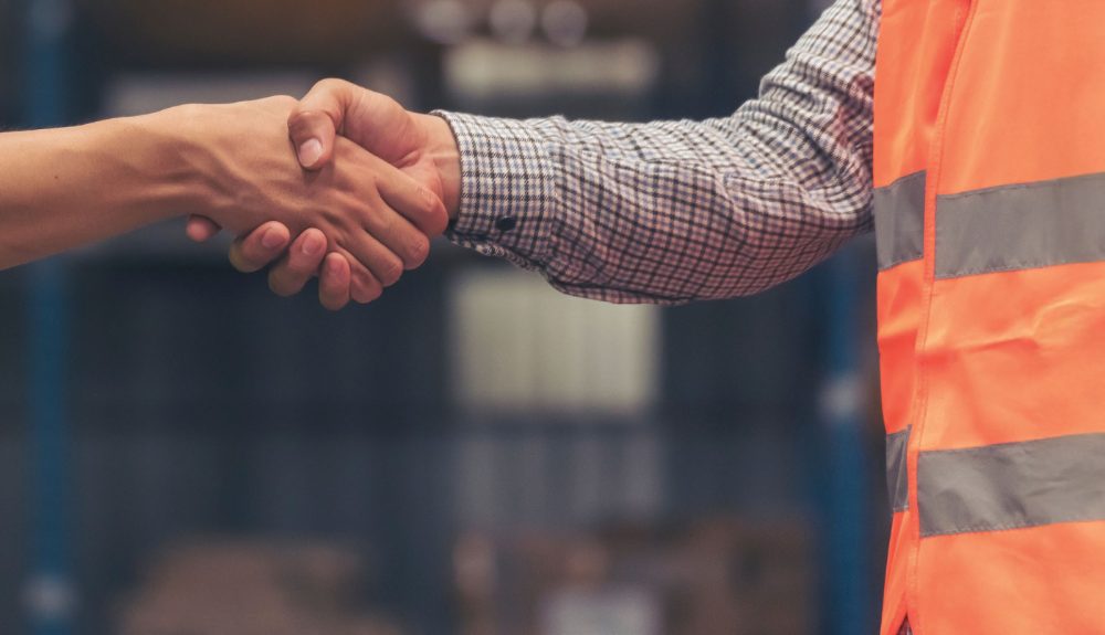 Fleet operator and supplier shaking hands