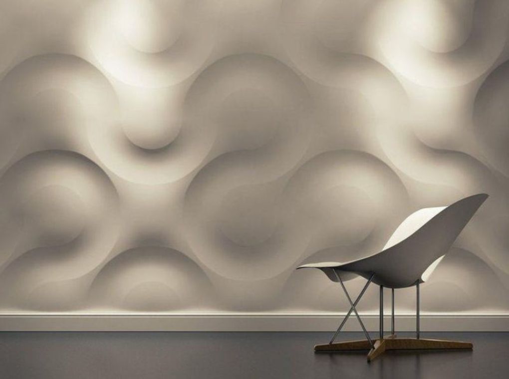 Modern white chair with wooden legs in front of a 3D textured wall with curved wave patterns.
