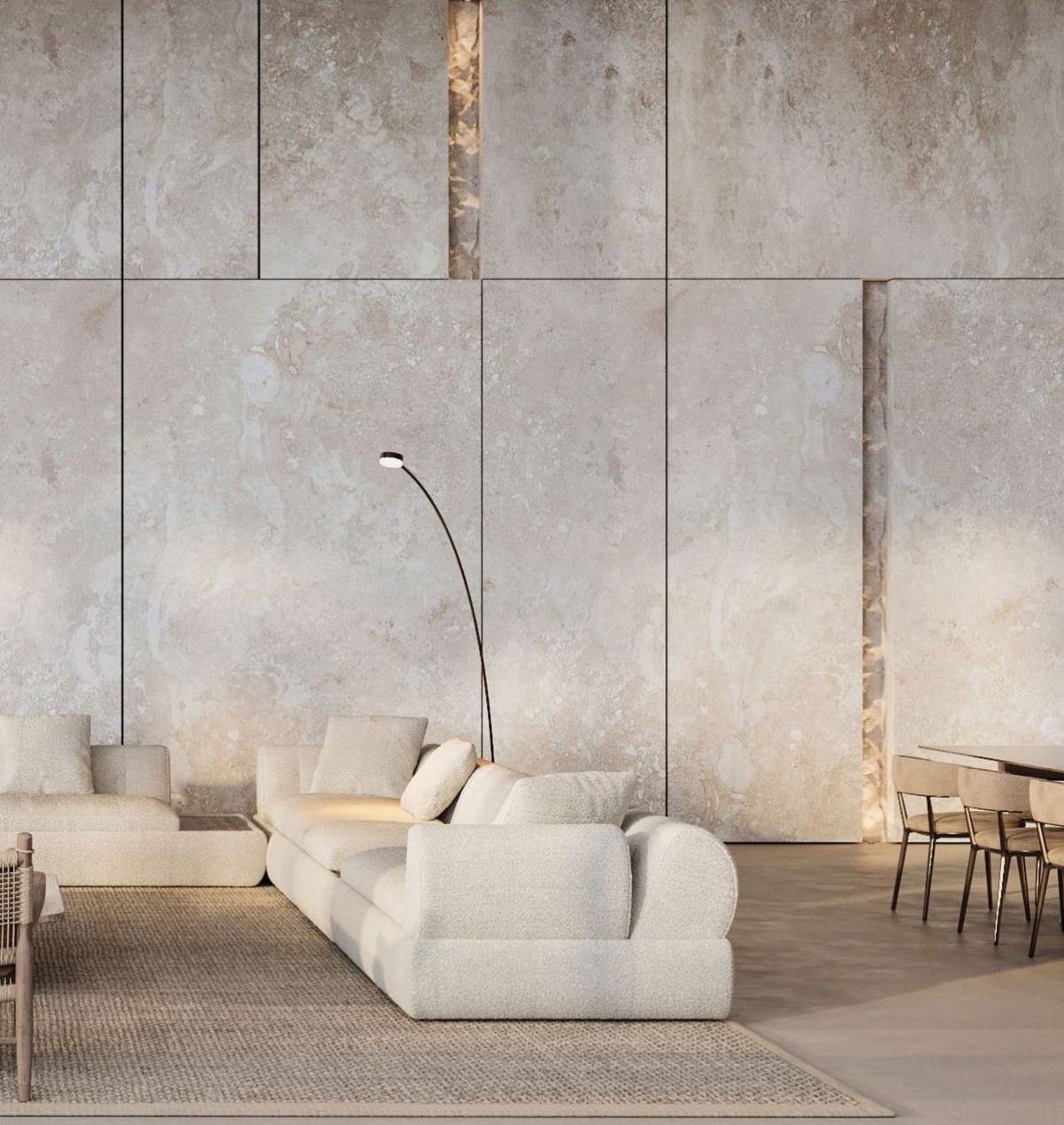 Modern living room with cream sofas, floor lamp, textured wall panels, dining table, and chairs.
