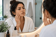 Esthetician performing a Hydrafacial treatment on a client's cheek at a Chicago med spa
