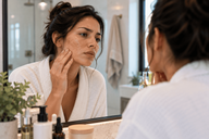 Woman receiving laser skin resurfacing treatment for acne scars and sun damage in Chicago, Illinois