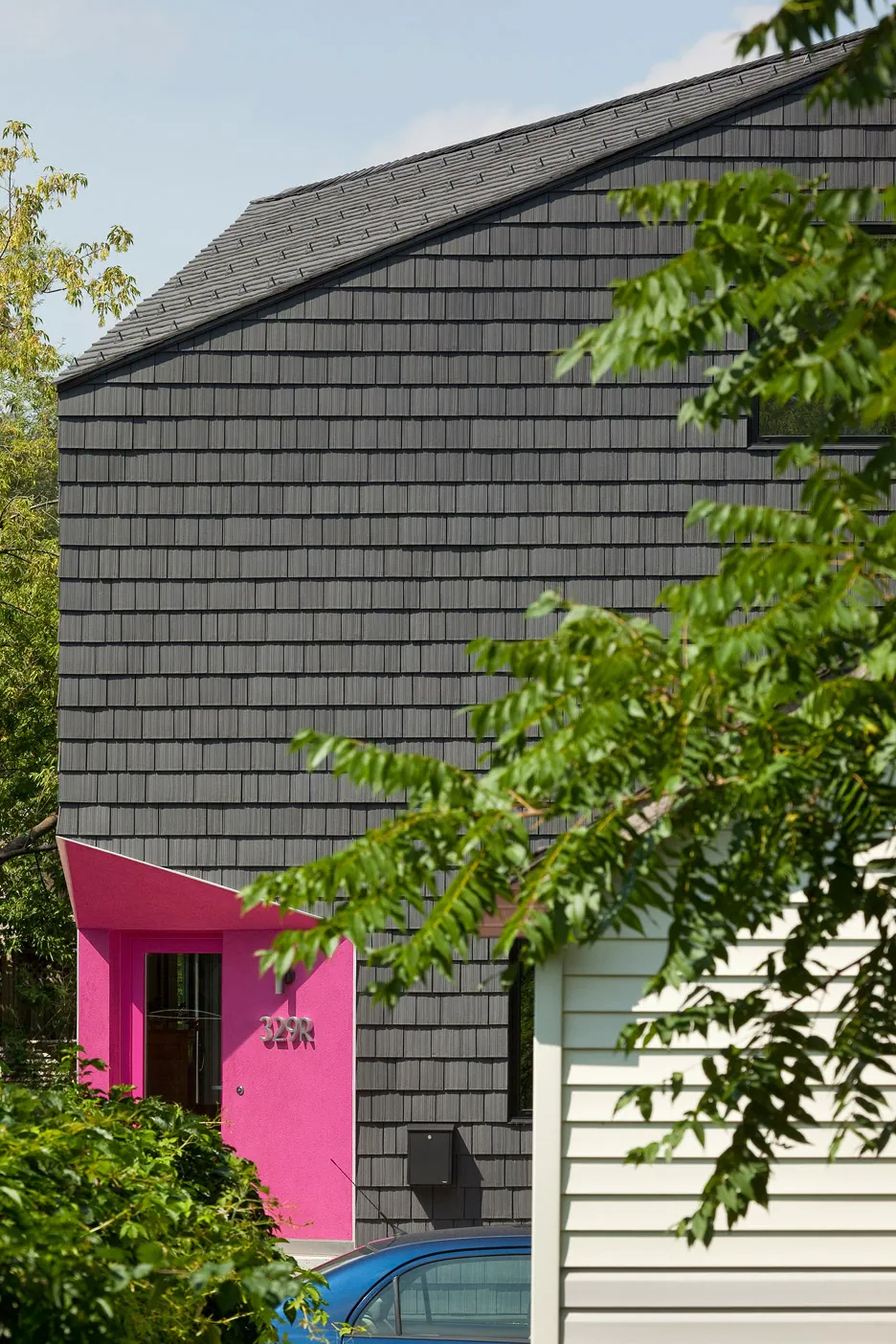 Charcoal Enviroshake synthetic cedar shakes on the roof and gable wall of a modern home