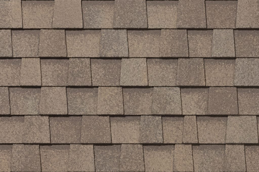 A close-up image of architectural shingles, showcasing textural variation.