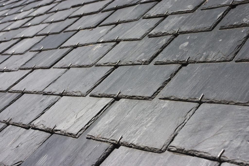 A close up of a traditional slate tile roofing system