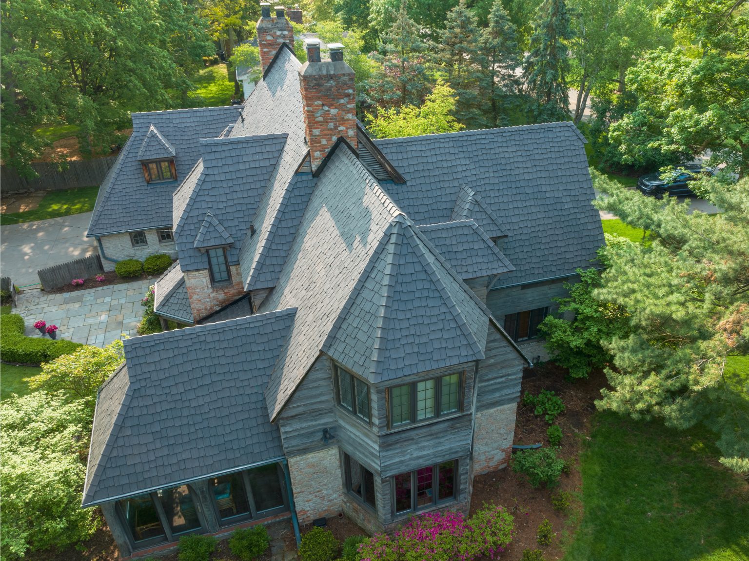 Aerial view of a home with an Enviroshake Aged Cedar roof in a staggered pattern