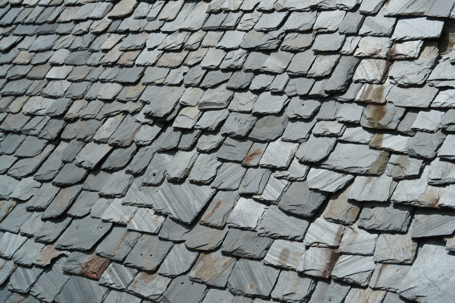 A close-up of a natural slate roof, displaying old-world aesthetics and historic curb appeal