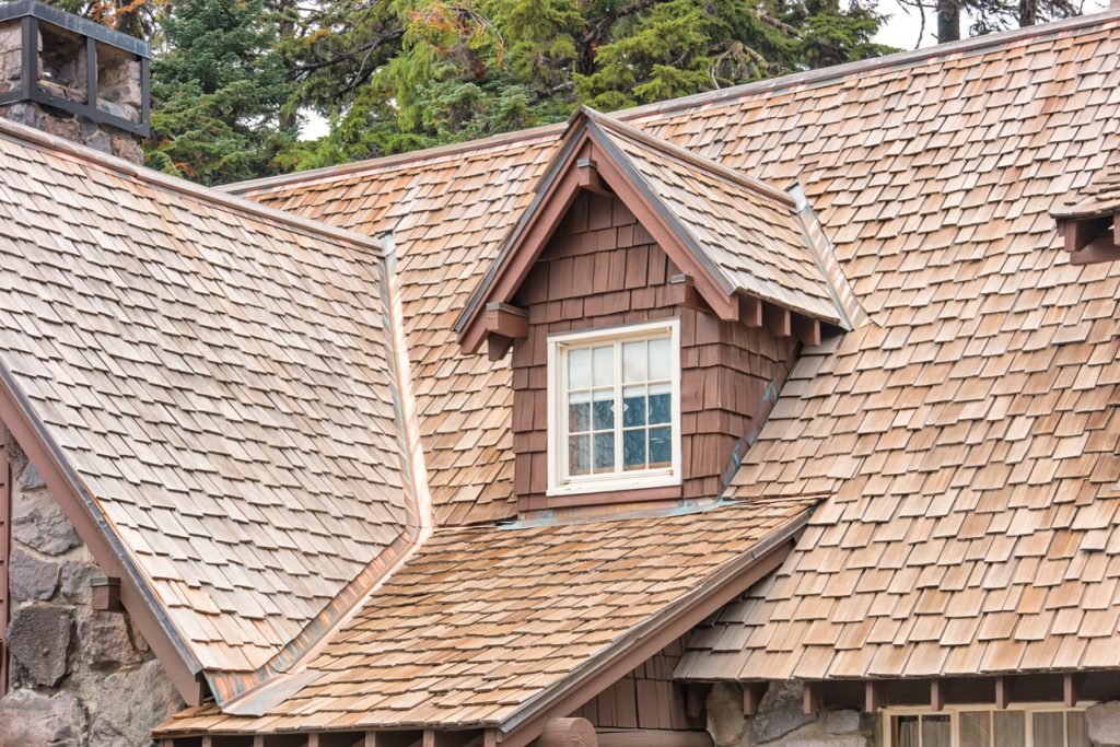 A freshly-installed cedar shake roof in a staggered configuration