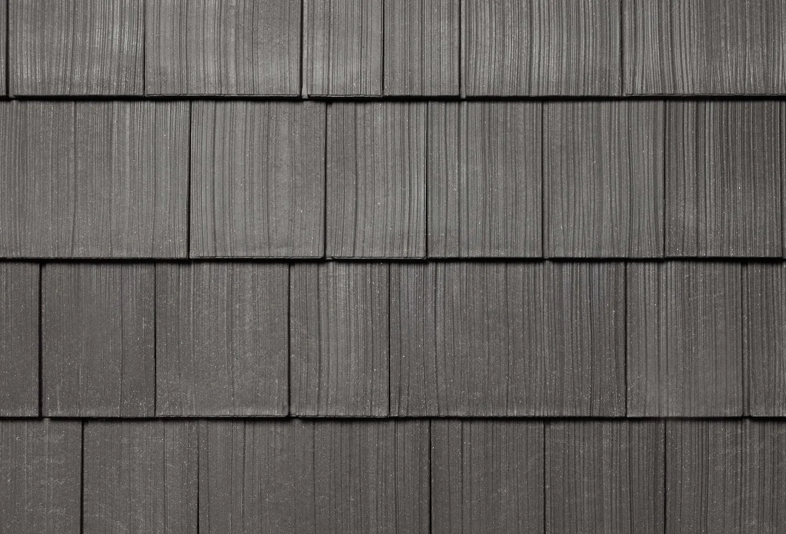 Enviroshake shingle swatch in Silvered Cedar, a light grey weathered finish