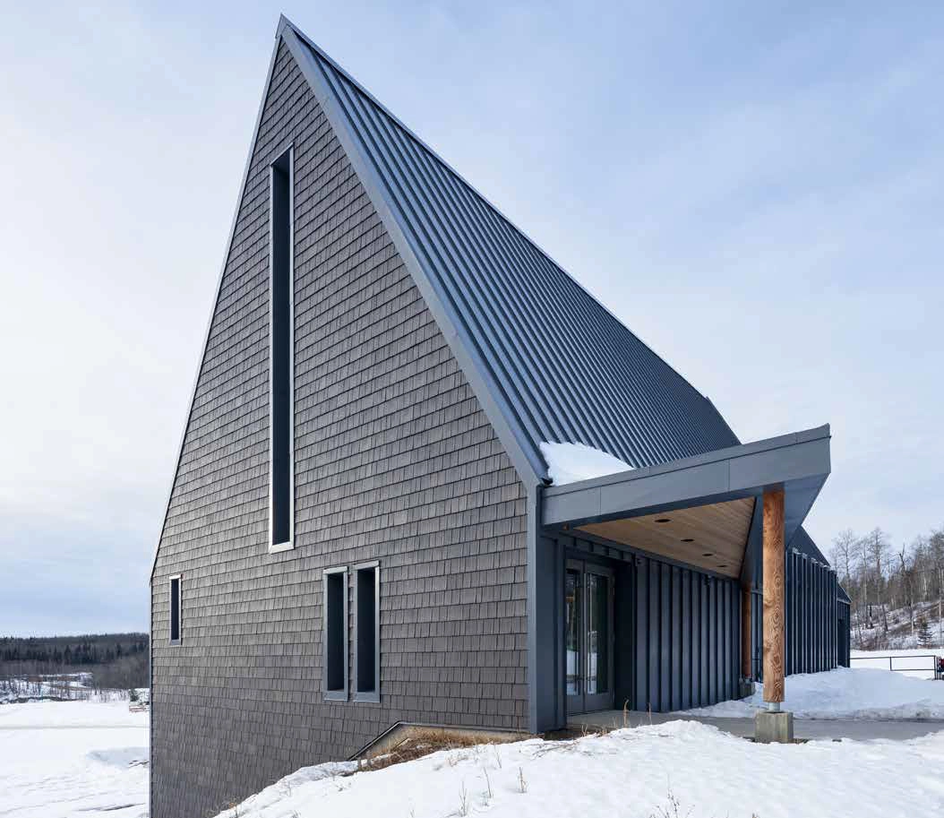 Enviroshake Aged Cedar installed as siding alongside standing seam metal on a cultural center