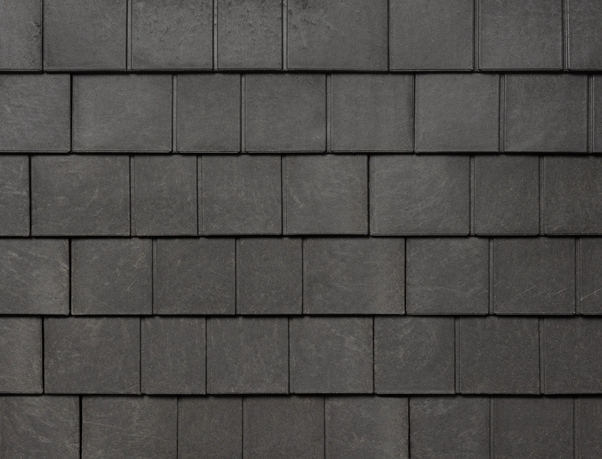 A swatch of Aged Cedar Enviroshingle, engineered to replicate the aesthetics of perfection cedar shingles