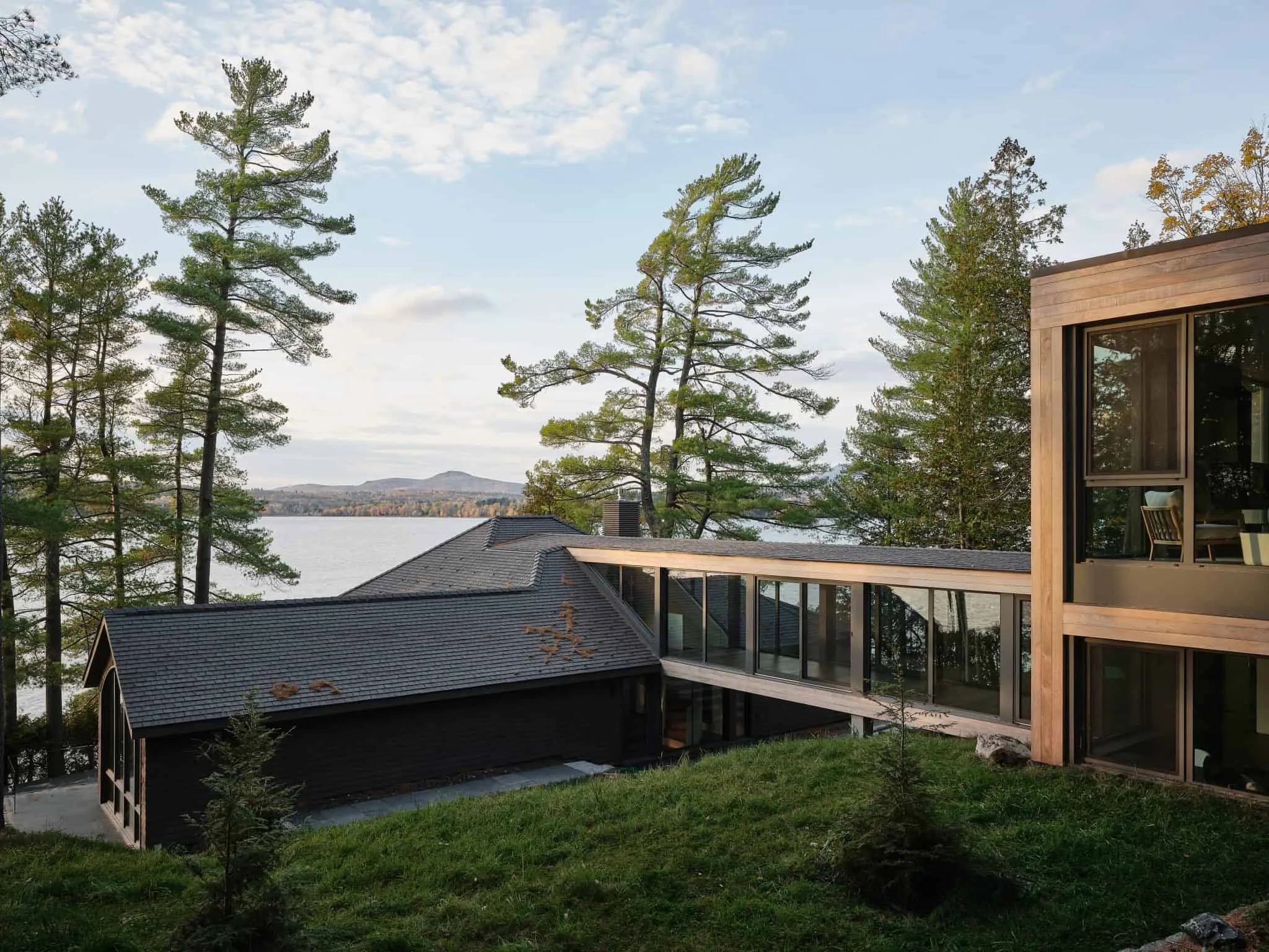 Modern lakeside home with Aged Cedar Enviroshingle roof tiles