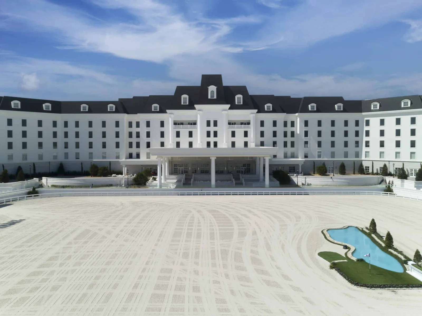 Black Enviroslate composite slate roofing on the World Equestrian Center hotel, featuring steep mansard-style rooflines and dormer windows.
