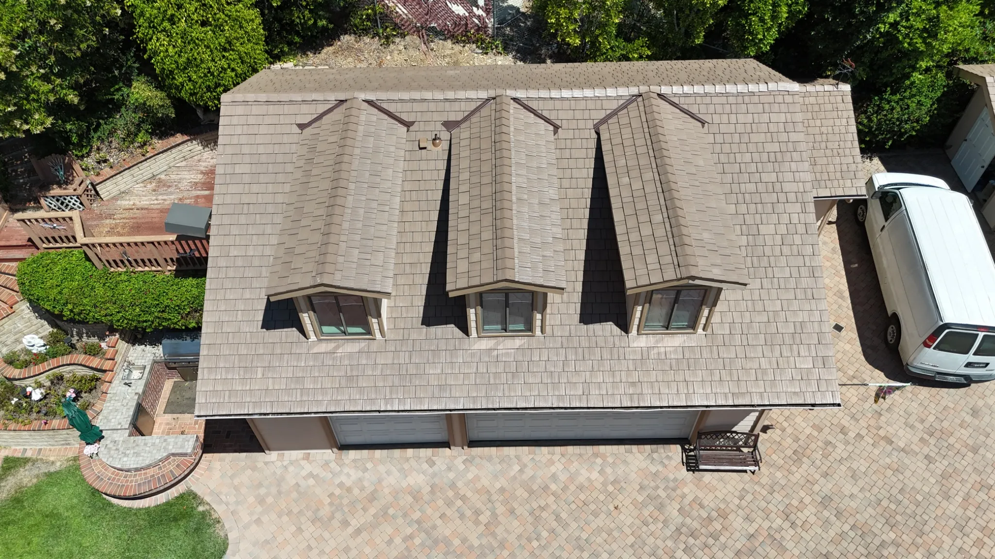 Aerial view of Disney Brown Enviroshake installed on a garage with three dormers