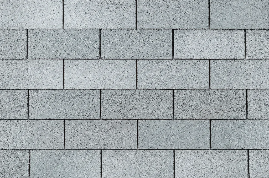 Close-up of grey three-tab asphalt shingles